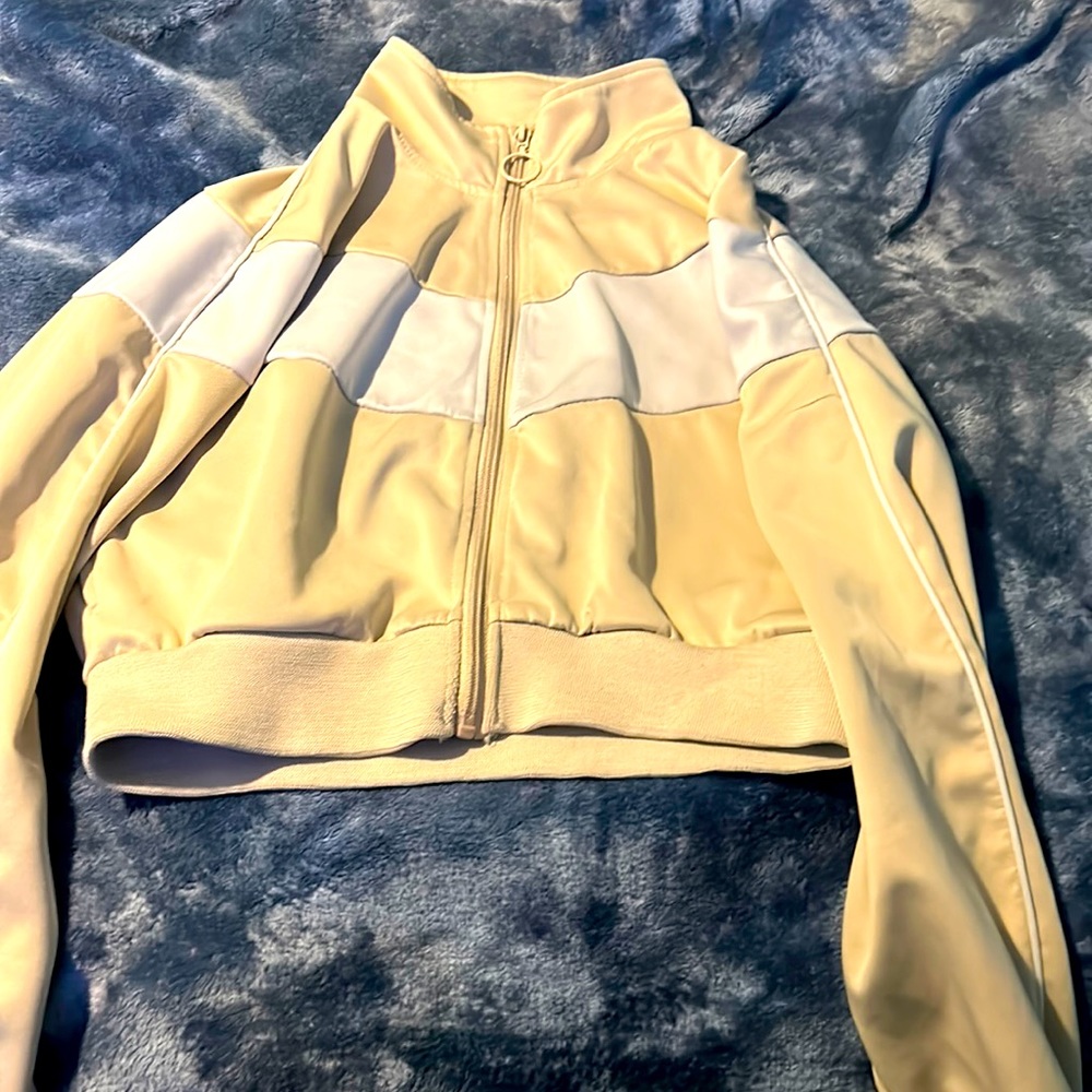 Beige and white coat size is a medium only been worn once